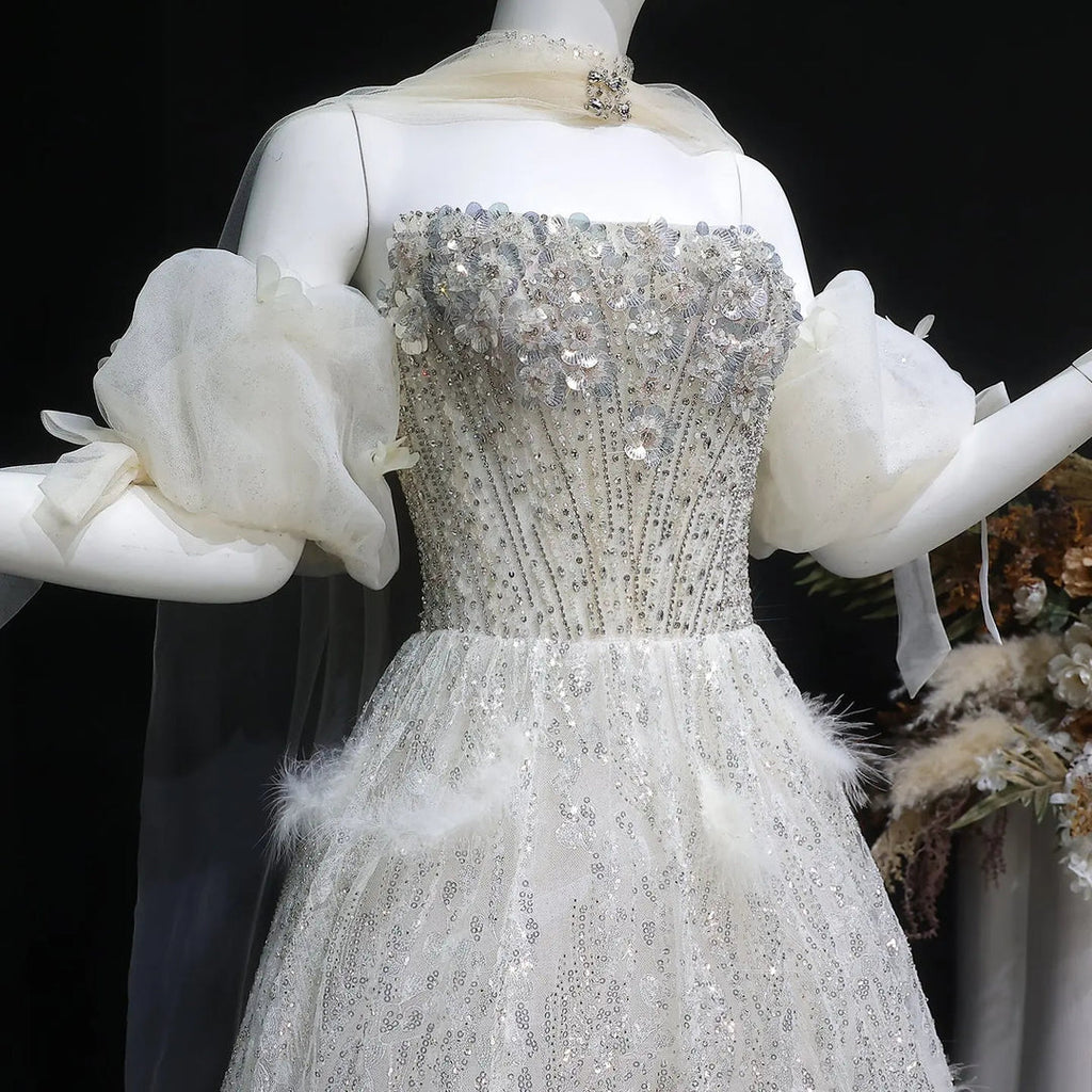 Elegant Beige Embellished Evening Gown with Petal Detailing SB011