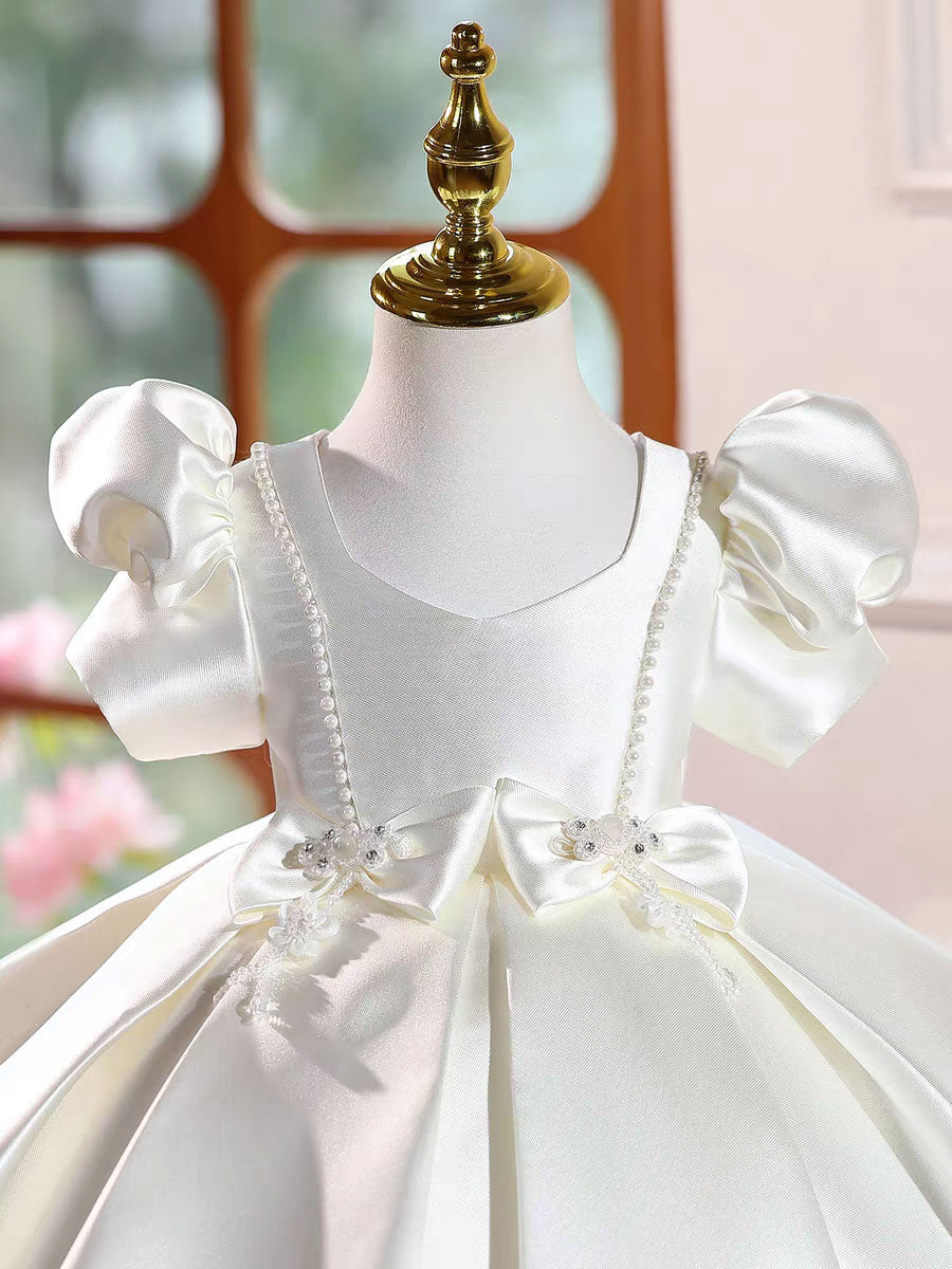 Penelope's White Pearl Bow Dress