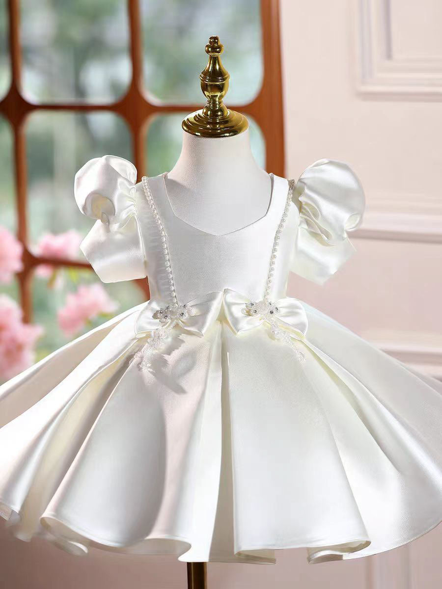 Penelope's White Pearl Bow Dress